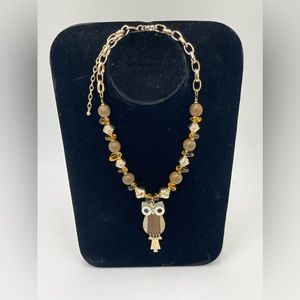 Santaellabyrey owl necklace made with wood and amber.